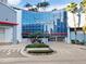 Exterior shot of the Towers building featuring modern architecture, lush landscaping, and a welcoming entrance at 1209 E Cumberland Ave # 1703, Tampa, FL 33602
