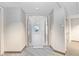 Condo entryway opening to a bright, open space with city views at 1209 E Cumberland Ave # 1703, Tampa, FL 33602