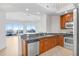 Modern kitchen featuring stainless steel appliances and granite countertops at 1209 E Cumberland Ave # 1703, Tampa, FL 33602
