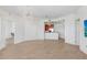 Open-concept living area with wood floors and view into kitchen area at 1209 E Cumberland Ave # 1703, Tampa, FL 33602
