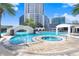 Stunning outdoor pool area featuring a bridge, jacuzzi, lounge chairs and lush landscaping in a resort-style setting at 1209 E Cumberland Ave # 1703, Tampa, FL 33602