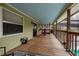 Expansive wooden deck with a vibrant blue ceiling, perfect for outdoor relaxation at 126 82Nd N Ave, St Petersburg, FL 33702