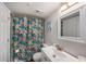 Updated bathroom featuring a colorful shower curtain and vanity at 12924 Gulf Blvd # 110, St Petersburg, FL 33708