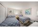 Comfortable bedroom with two beds, light walls and closet at 12924 Gulf Blvd # 110, St Petersburg, FL 33708