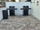 Outdoor grilling area with two grills and outdoor storage at 12924 Gulf Blvd # 110, St Petersburg, FL 33708