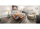Cozy main bedroom featuring wood floors, calming decor, a queen bed and shuttered windows at 12924 Gulf Blvd # 110, St Petersburg, FL 33708