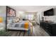 Cozy main bedroom featuring wood floors, calming decor, a queen bed and shuttered windows at 12924 Gulf Blvd # 110, St Petersburg, FL 33708