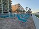 Enjoy outdoor seating beneath shaded tiki huts with views of the beach and gentle ocean breezes at 12924 Gulf Blvd # 110, St Petersburg, FL 33708