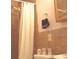 Bathroom including a shower with a shower curtain, toilet and sink at 1345 Drew St # 5, Clearwater, FL 33755