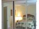 Bright bedroom view through closet doors, showcasing peaceful design elements at 1345 Drew St # 5, Clearwater, FL 33755