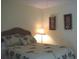 Serene bedroom featuring a comfortable bed with palm tree-patterned bedding at 1345 Drew St # 5, Clearwater, FL 33755