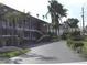 Inviting exterior of a multi-story home with a well-maintained lawn and driveway at 1345 Drew St # 5, Clearwater, FL 33755