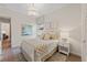 Comfortable bedroom featuring a neutral color palette, stylish decor and ample natural light at 15539 Stuart Cir, Port Charlotte, FL 33981
