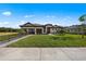 Charming home features a manicured lawn, tile roof and neutral color palette at 15539 Stuart Cir, Port Charlotte, FL 33981