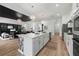 Bright, open-concept kitchen features a large island with modern appliances and stylish lighting at 15539 Stuart Cir, Port Charlotte, FL 33981