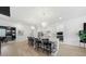 Modern kitchen with white cabinets, decorative island, and stainless steel appliances at 15539 Stuart Cir, Port Charlotte, FL 33981