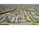 An aerial view of a townhome community with landscaping, parking and easy access to main roads at 16143 Rambling Vine E Dr, Tampa, FL 33624