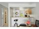 Cozy dining area next to kitchen with a breakfast bar, perfect for casual dining and entertaining guests at 16143 Rambling Vine E Dr, Tampa, FL 33624