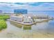 Elevated view of beachfront condos, swimming pool, and Gulf water views at 2506 N Rocky Point Dr # 358, Tampa, FL 33607