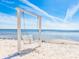 Picturesque white swing set on a sandy beach with ocean views at 2506 N Rocky Point Dr # 358, Tampa, FL 33607