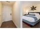 Bright bedroom with a comfy bed, a decorative headboard, and tiled floors at 2506 N Rocky Point Dr # 358, Tampa, FL 33607