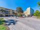 Exterior view of community entrance with well maintained landscaping and a welcome center at 2506 N Rocky Point Dr # 358, Tampa, FL 33607