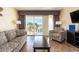 Comfortable living room with balcony offering ocean views, stylish furniture, and a relaxing atmosphere at 2506 N Rocky Point Dr # 358, Tampa, FL 33607
