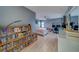 Cozy bedroom features a ceiling fan and plenty of shelving for storage and personal display at 2650 Countryside Blvd # F209, Clearwater, FL 33761