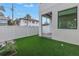 The backyard offers a fenced-in area with artificial grass and easy access to the home at 2810 N Massachusetts Ave, Tampa, FL 33602