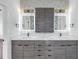 Modern bathroom boasting a double vanity with illuminated mirrors at 2810 N Massachusetts Ave, Tampa, FL 33602