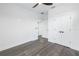 Simple bedroom with closet and grey wood-look flooring at 2810 N Massachusetts Ave, Tampa, FL 33602