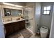 Updated bathroom with a glass-enclosed shower and a modern vanity with marble countertop at 3497 Birchwood Ct, Palm Harbor, FL 34684