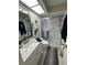 Clean bathroom featuring a modern toilet, a stylish vanity, and a glass shower at 3497 Birchwood Ct, Palm Harbor, FL 34684