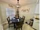 Cozy breakfast nook featuring a round table, window with natural light, and decorative accents at 3497 Birchwood Ct, Palm Harbor, FL 34684