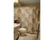 Modest bathroom with a decorative shower curtain, tiled floors, and a single vanity at 3710 98Th N Ave, Pinellas Park, FL 33782