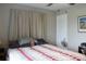 Inviting bedroom with soft lighting, neutral curtains, and a cozy patterned quilt at 3710 98Th N Ave, Pinellas Park, FL 33782