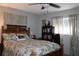 Comfortable bedroom showcasing a decorative ceiling fan, patterned bedding, and tasteful decor at 3710 98Th N Ave, Pinellas Park, FL 33782