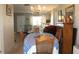 Charming dining area with chandelier, wood furniture and natural light, creating a warm and inviting atmosphere at 3710 98Th N Ave, Pinellas Park, FL 33782