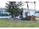 Inviting single-story home with well-manicured landscaping around the house and beautiful flower beds in the front yard at 3710 98Th N Ave, Pinellas Park, FL 33782
