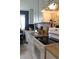 Functional kitchen featuring granite countertops, white cabinetry, stainless steel appliances, and tile backsplash for enhanced convenience at 3710 98Th N Ave, Pinellas Park, FL 33782
