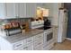 Well-organized kitchen featuring granite counters, white cabinetry, stainless steel appliances and tiled backsplash for convenience at 3710 98Th N Ave, Pinellas Park, FL 33782