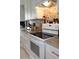 Updated kitchen featuring granite countertops, stainless steel appliances, white cabinetry and stone backsplash for added style at 3710 98Th N Ave, Pinellas Park, FL 33782