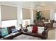 Bright living room with brown leather seating, an area for dining, and large bright windows at 3710 98Th N Ave, Pinellas Park, FL 33782