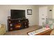 Cozy living room featuring a love seat and fireplace with a mounted TV, creating a relaxing atmosphere at 3710 98Th N Ave, Pinellas Park, FL 33782