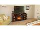 Cozy living room featuring a fireplace, television, and comfortable seating at 3710 98Th N Ave, Pinellas Park, FL 33782