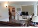 Open living space with modern decor, including a large TV and ample seating, creating a comfortable environment at 3710 98Th N Ave, Pinellas Park, FL 33782