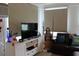 Comfortable living room showcasing an entertainment center, large TV, and cozy seating at 3710 98Th N Ave, Pinellas Park, FL 33782