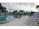 Community pool featuring lounge chairs, tables, covered area and well maintained water at 3710 98Th N Ave, Pinellas Park, FL 33782