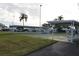 Outdoor shuffleboard courts featuring shaded seating and well maintained green areas at 3710 98Th N Ave, Pinellas Park, FL 33782