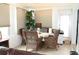 Bright sunroom featuring wicker furniture and natural light, creating a relaxing and inviting atmosphere at 3710 98Th N Ave, Pinellas Park, FL 33782
